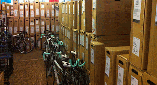 Road bikes in boxes and out.