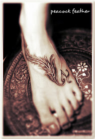 peacock feather tattoo on the foot
