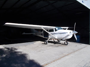 The plane in the hangar.