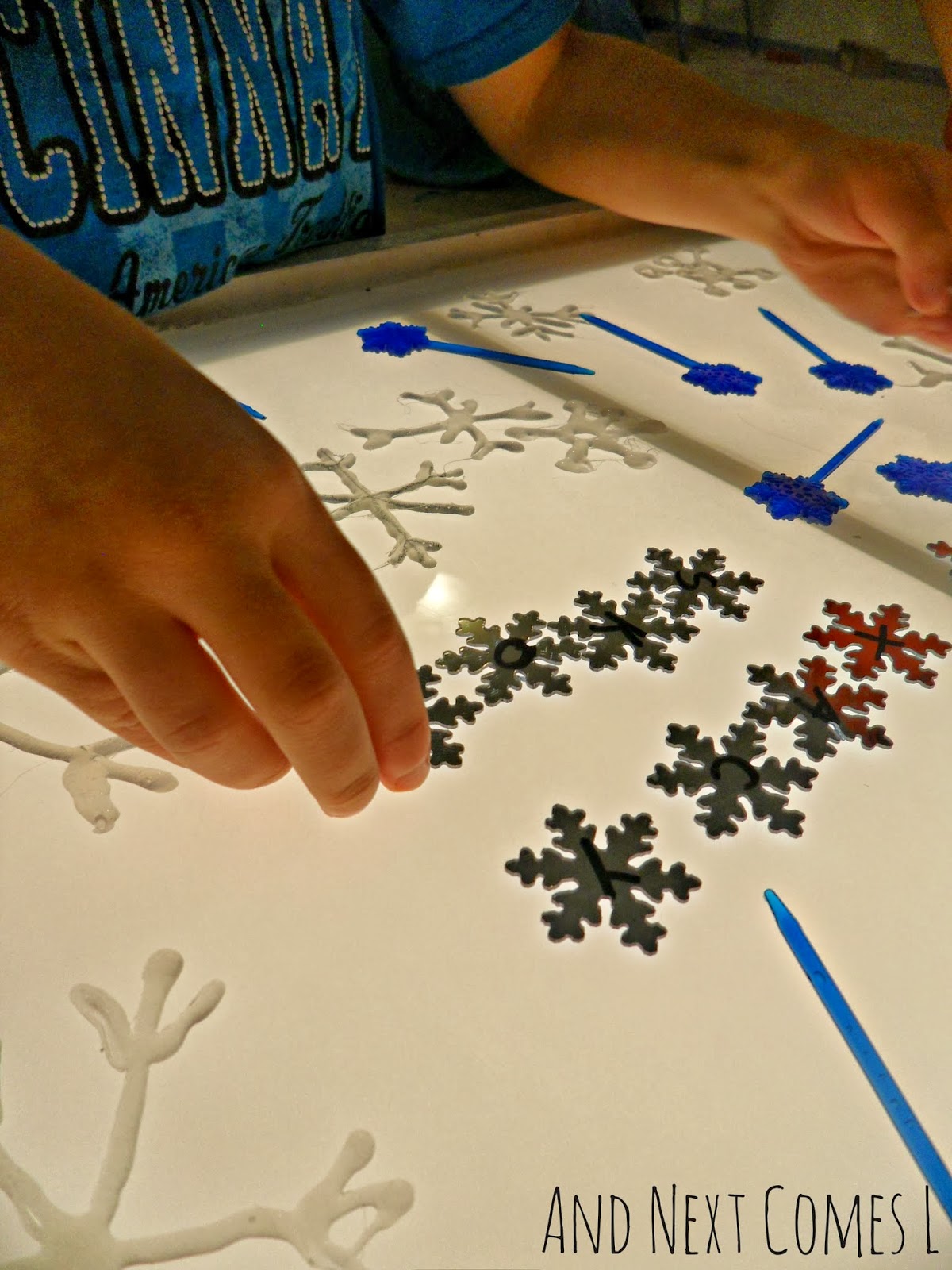 Snowflake Light Table Play & 14 Other Christmas/Winter Fine Motor Light Table Ideas And Next
