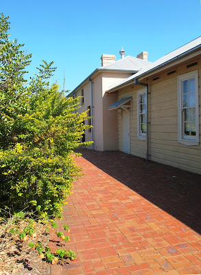 Side of a two-storied traditional Australian house.