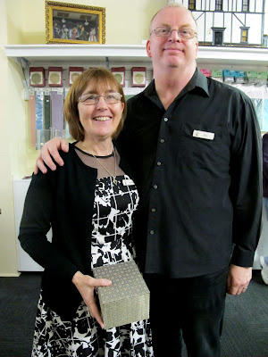 The owners of Fairy Meadow Miniatures shop waiting to draw the raffle.