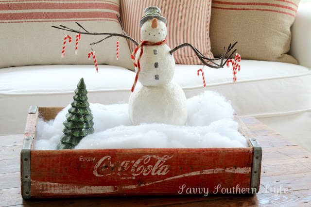 Snowman in a coke crate vignette, by Savvy Southern Style, featured on I Love That Junk. Check out this tour for the entire sunroom!