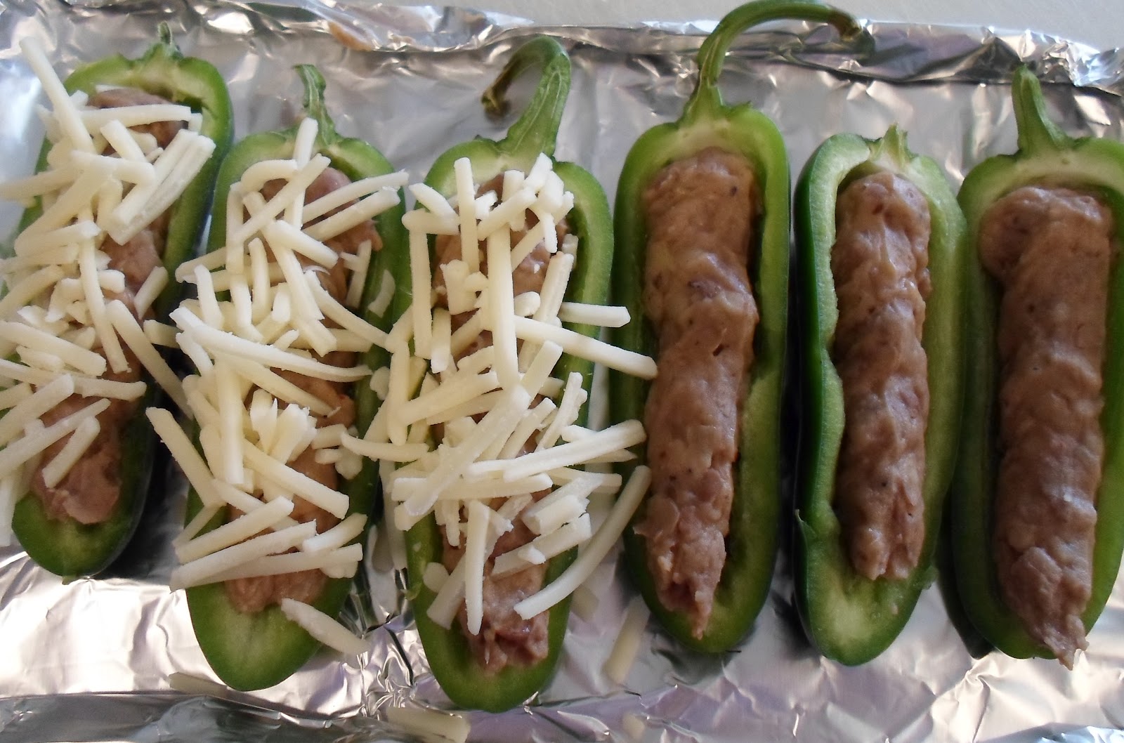 Happier Than A Pig In Mud Refried Bean and Cheddar Stuffed Jalapenos