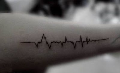 ECG pulse tattoo on the arm