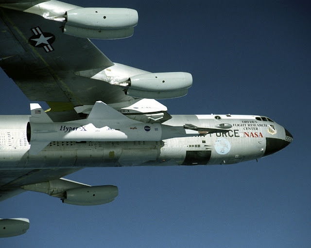  NASA's B-52B launch aircraft cruises to a test range here carrying an X-43A hypersonic research aircraft attached to a Pegasus rocket.