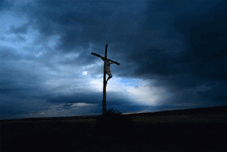 Jesus Christ on the Cross in blue sky background(evening) photo download for free