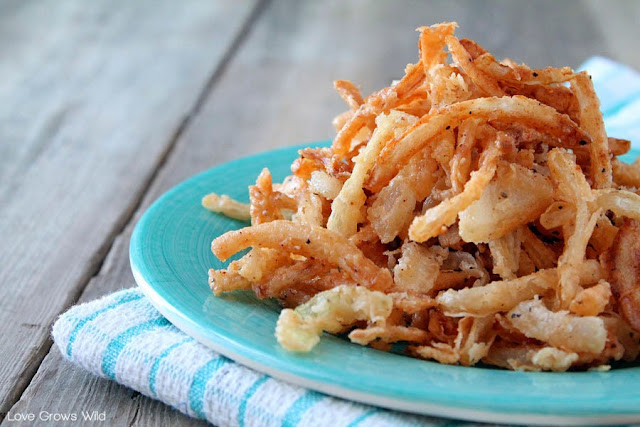 Homemade Crispy Onion Strings - skip the store-bought can of fried onions and make your own with this easy and delicious recipe! Perfect for casseroles, burgers, salads, and more!