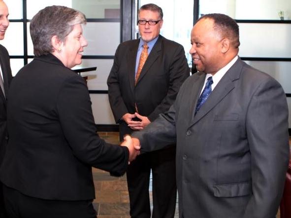 Secretary Janet Napolitano shakes hands