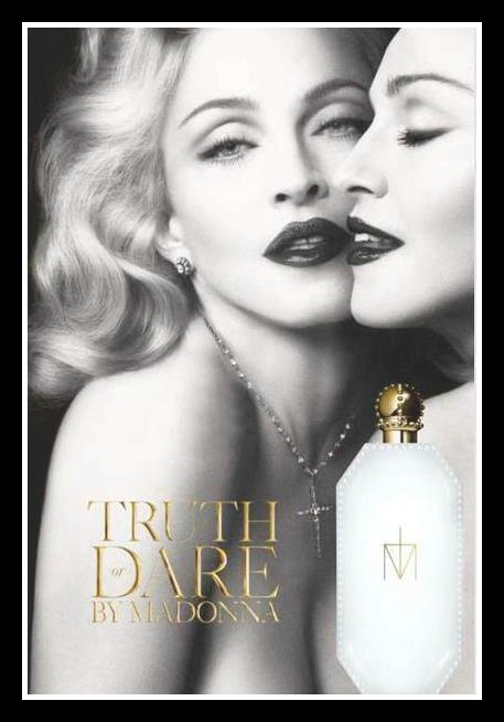 The black and white ad shows a glamorous Madonna topless caressing her own 