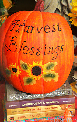 Pumpkin in Store Window with Blessings and Books