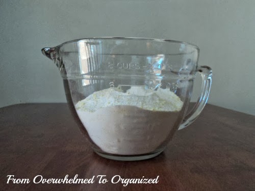 DIY laundry detergent in a measuring cup.