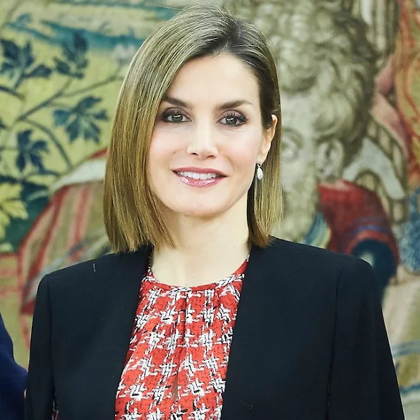 Queen Letizia  attends an audience with a Representation of Gypsy Secretariat Foundation at Zarzuela Palace. Queen Letizia wore ZARA Cape Jacket - HUGO BOSS Taru Trousers - Magrit pumps Tous Jewelery