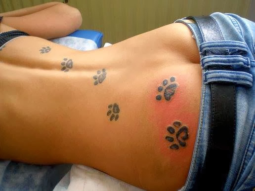 Dog+Paw+Prints+Tattoos+On+Girl+Back.jpg