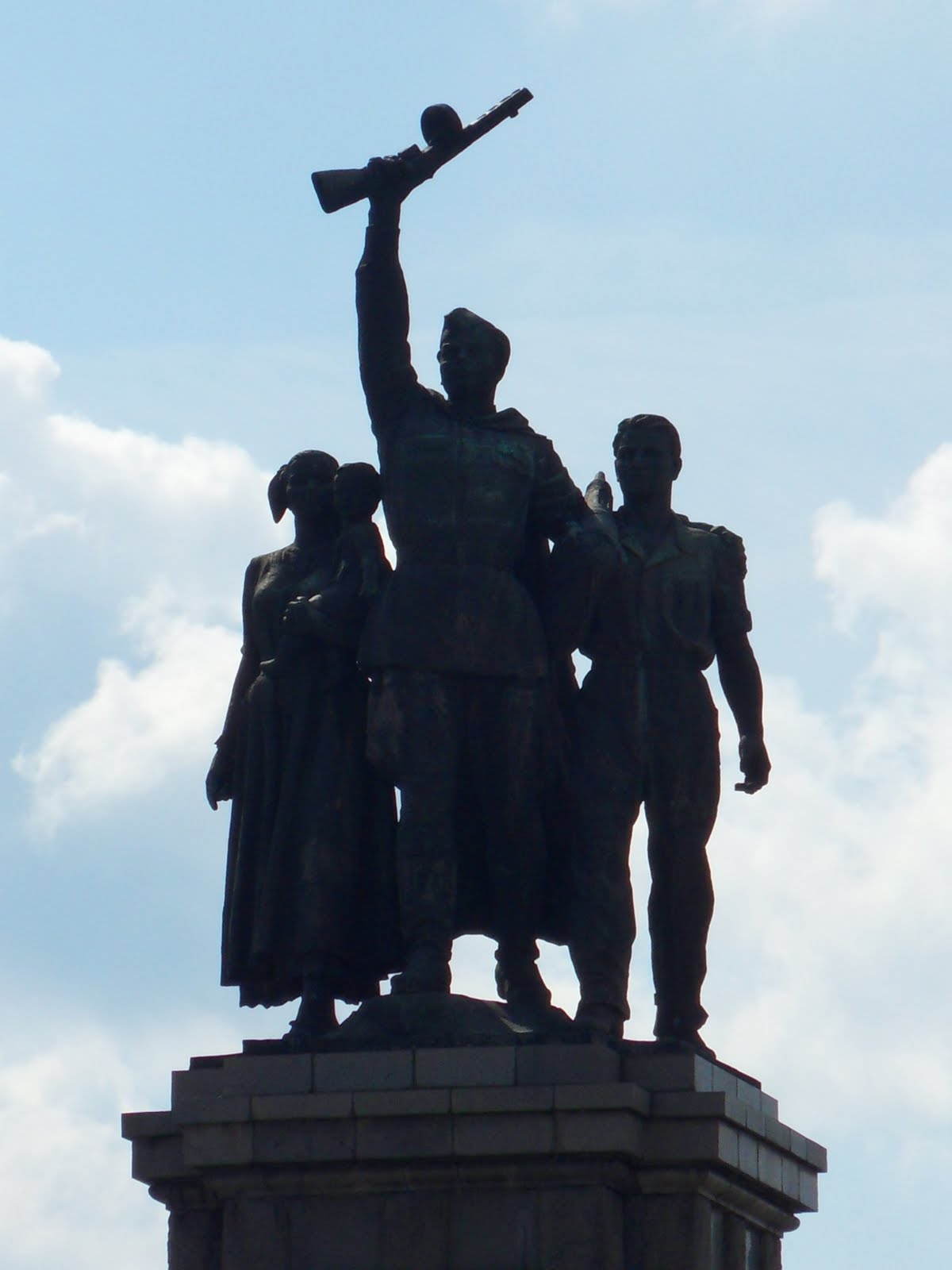 Download Man Woman And Child Statue Background