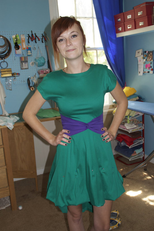 Sewing with shortening a dress.