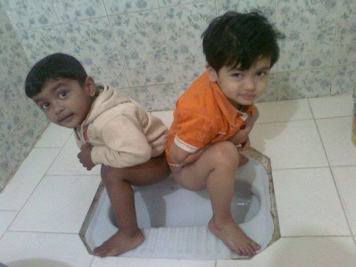Boys having fun in bathrooms