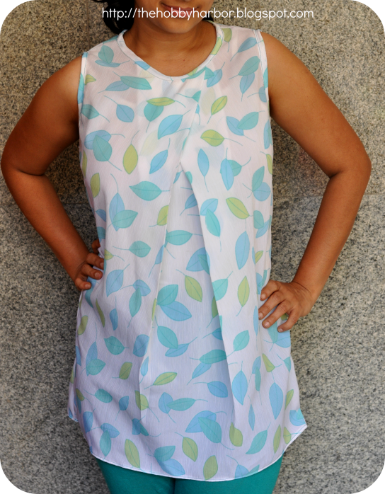 Top or blouse with pleated neckline the pleat i crossover made from my image sewing magazine with a fabric which has leaf print and back closure with hook and eye