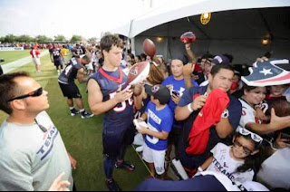 Intern Ethan Martinez keeps an eye on fans at the Houston Texans Training Camp.