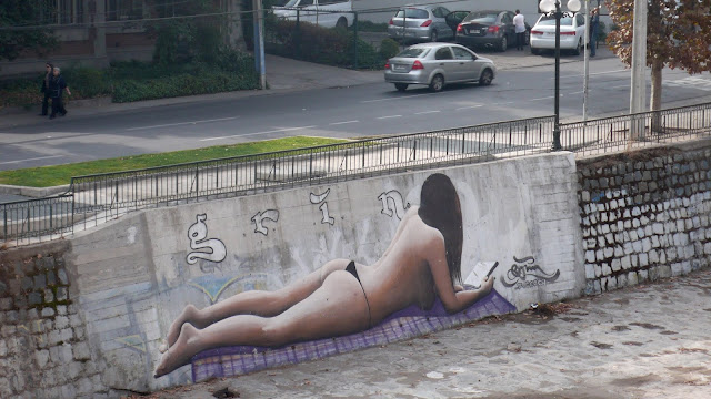 grin graffiti street art in bellavista, santiago de chile