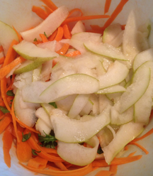 close up of Carrot and Pear Ribbons in bowl before marinating in lemons juice