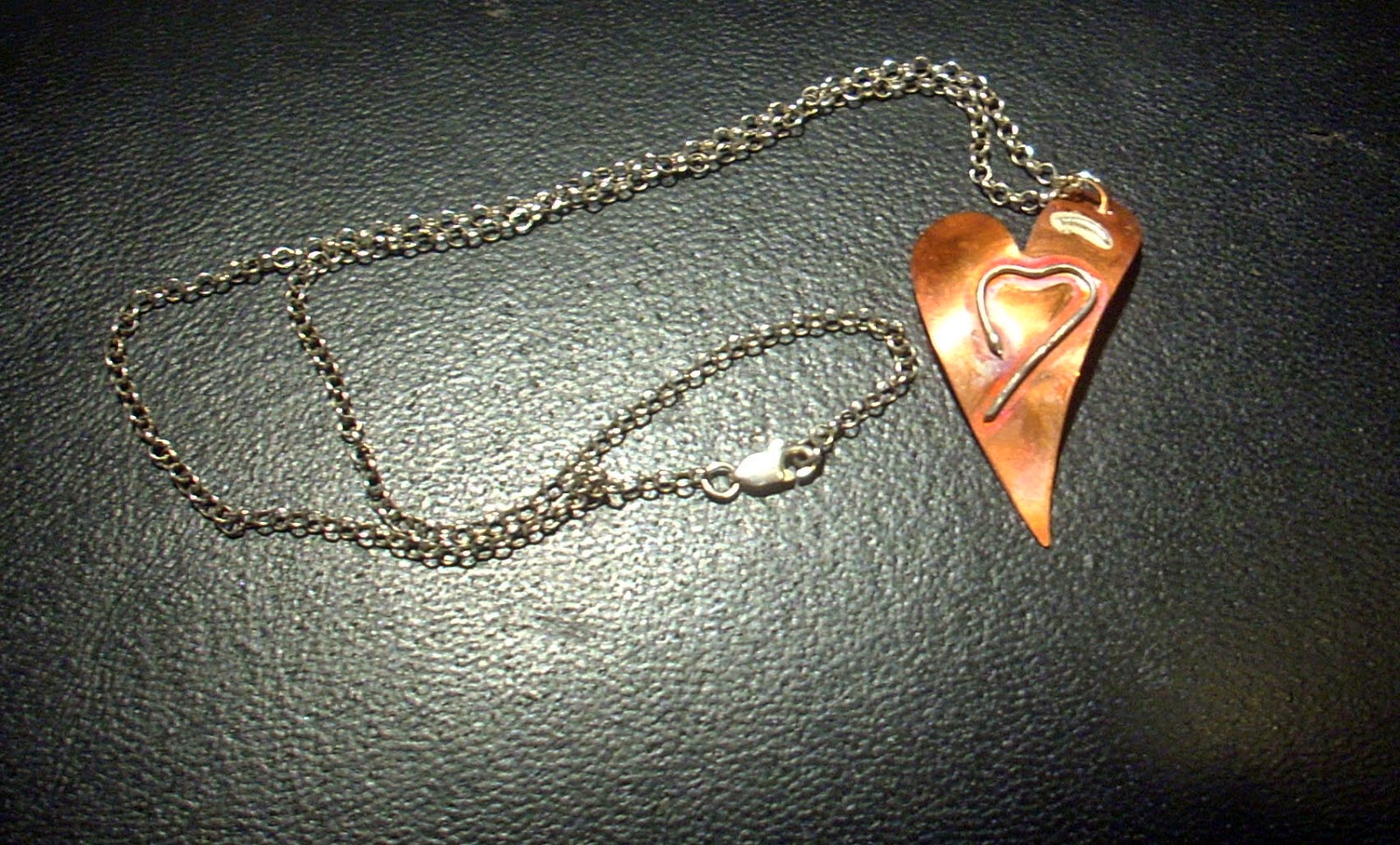 http://www.wowthankyou.co.uk/vintage-beadery/products/open-heart-silver-on-copper-pendant/