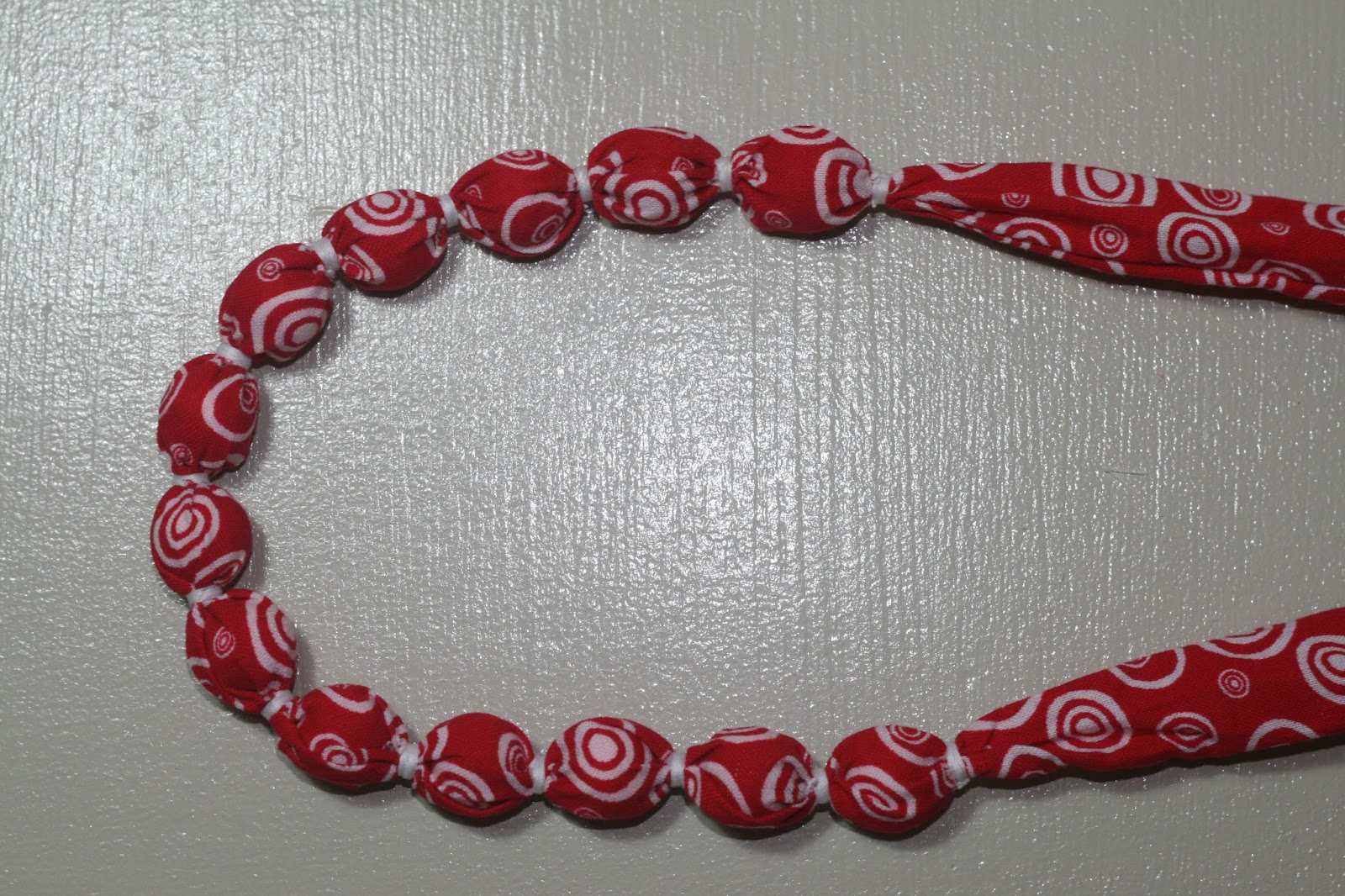 Fabric covered beads necklace for a toddler with tutorial While she