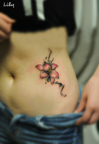 pink lily tattoo on the hip