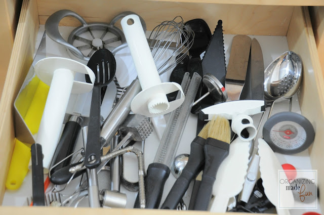 Before: Super messy, unorganized utensil drawer :: OrganizingMadeFun.com