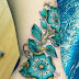 Indigo color flower tattoo on wrist 
