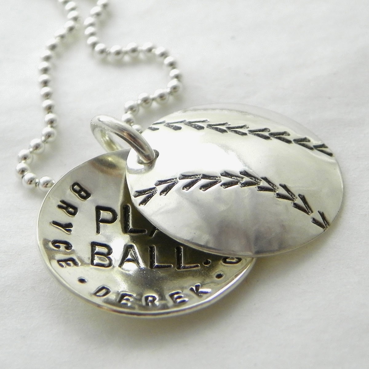 http://shop.punkyjane.com/Baseball-hand-stamped-and-personalized-faux-locket-4514.htm