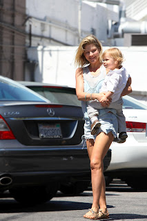 Ali Larter carrying her son at a parking lot