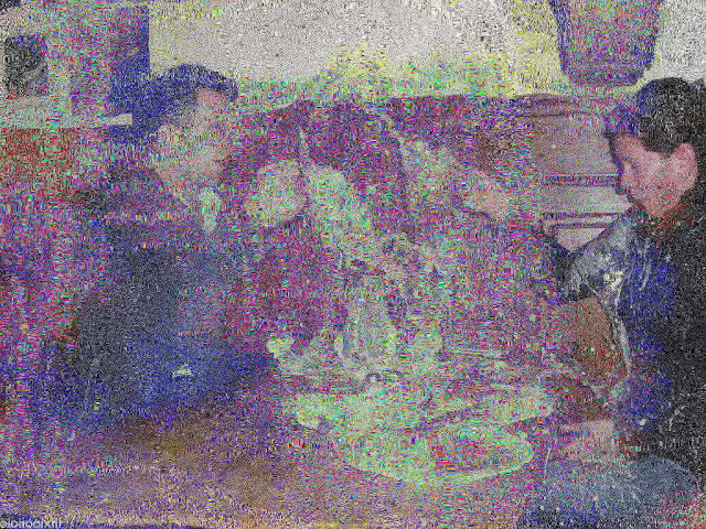 A degraded jpeg image showing two people smashing beer glasses together