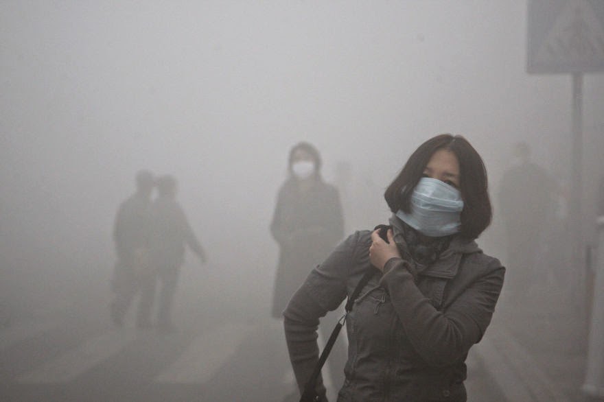 #18 Girl Walks Through Smog In Beijing, Where Small-Particle Pollution Is 40 Times Over International Safety Standard - 22 Heartbreaking Photos Of Pollution That Will Inspire You To Recycle #18 Girl Walks Through Smog In Beijing, Where Small-Particle Pollution Is 40 Times Over International Safety Standard - 22 Heartbreaking Photos Of Pollution That Will Inspire You To Recycle