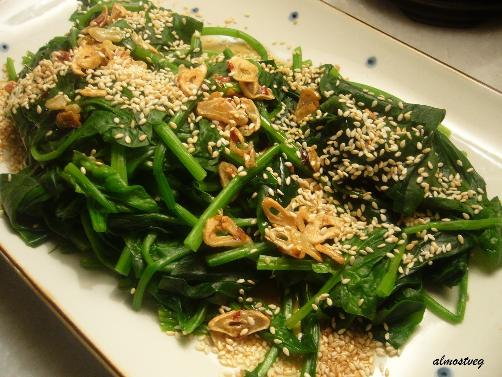 Steamed spinach with garlic chips