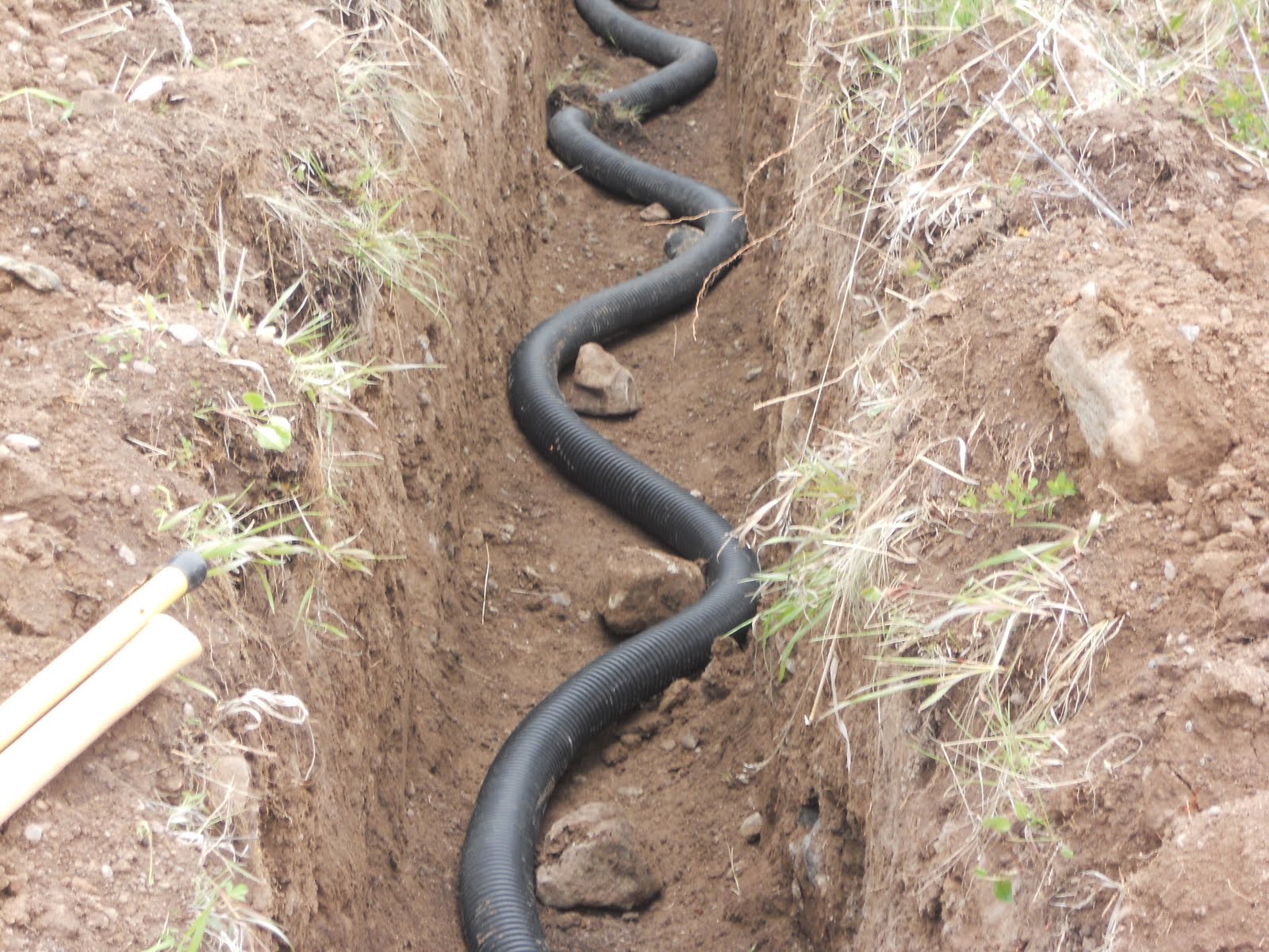 ZEN AND THE ART OF BUILDING A CABIN brought the earth tubes to the site and began the