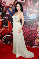 Dita Von Teese shows off her curves in a gown