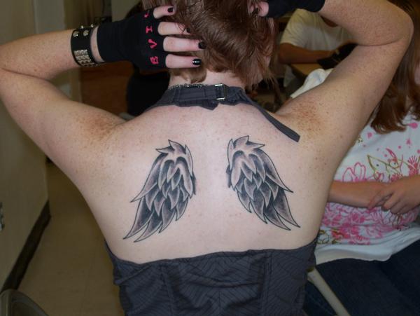 female wing tattoos