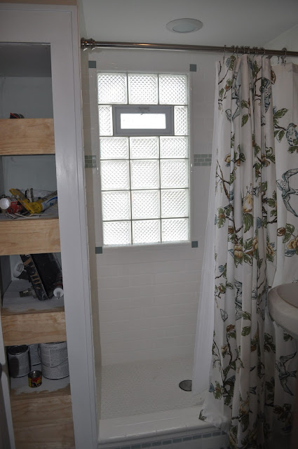 bathroom, reno, subway tile, sea glass tile, glass tile, white grout, grout, glass block window, hex tile