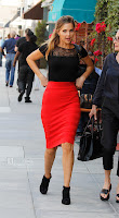 Arielle Kebbel pulling up her red skirt