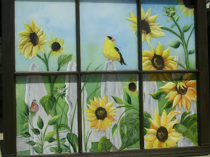 sunflowers fence on window