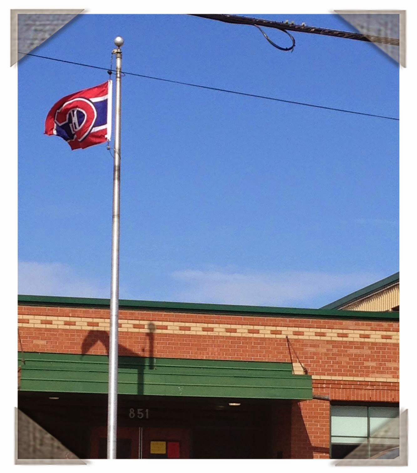 Habs flag flies outside West Island College in Dollard-des-Ormeaux, Quebec