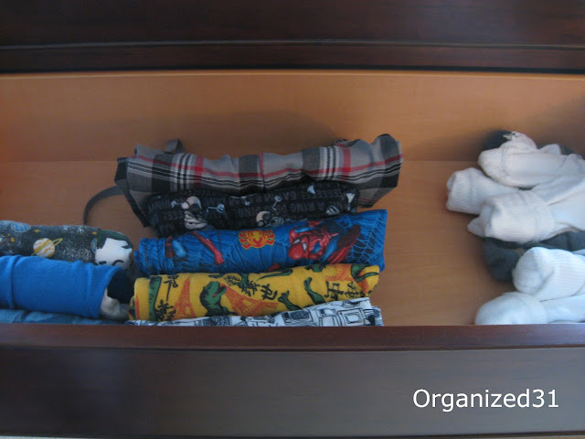 pajama pants and sock organized in a dresser drawer