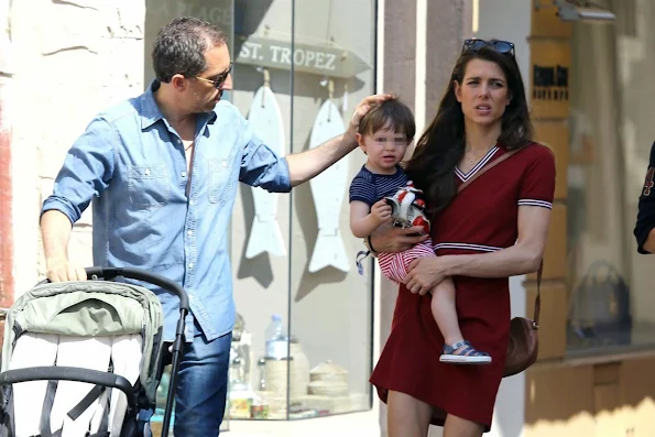 Charlotte Casiraghi and Gad Elmaleh with their baby Raphael walking and shopping in the streets of Saint-Tropez, France