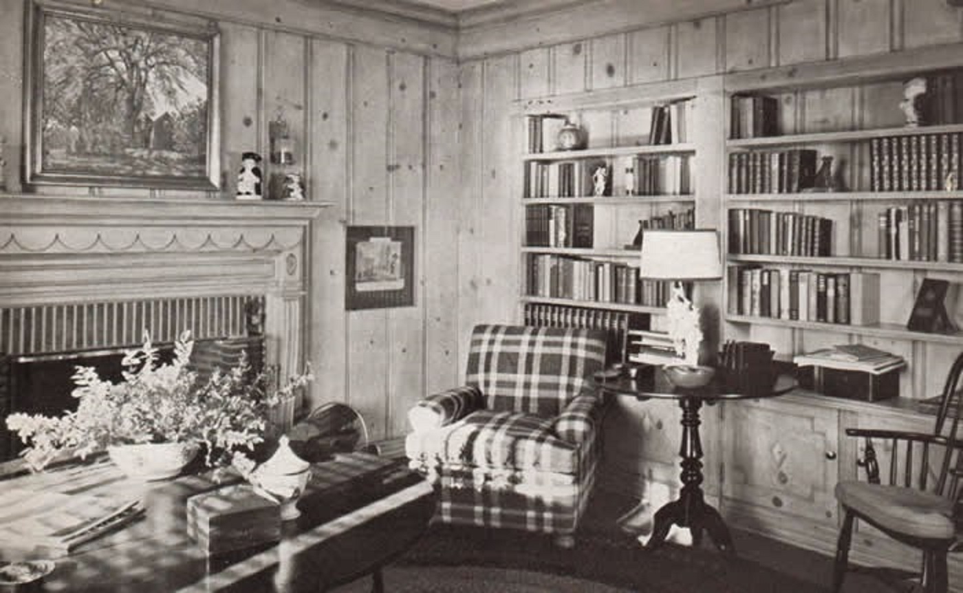 The Burns' library showing the oil painting Dooryard Elm by Robert Strong Woodward.