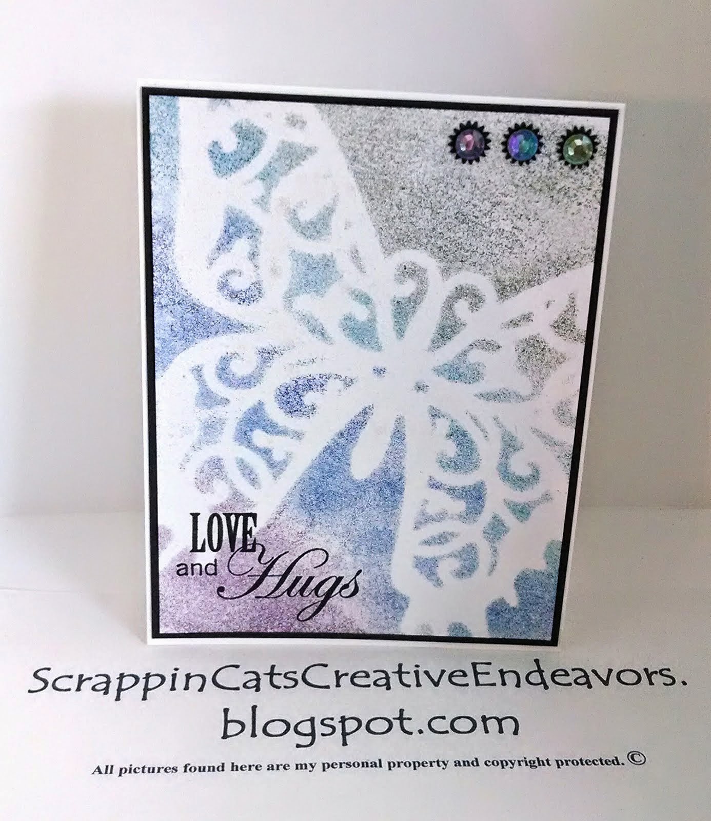 to Scrappin' Cat's Creative Endeavors Sponged inks over