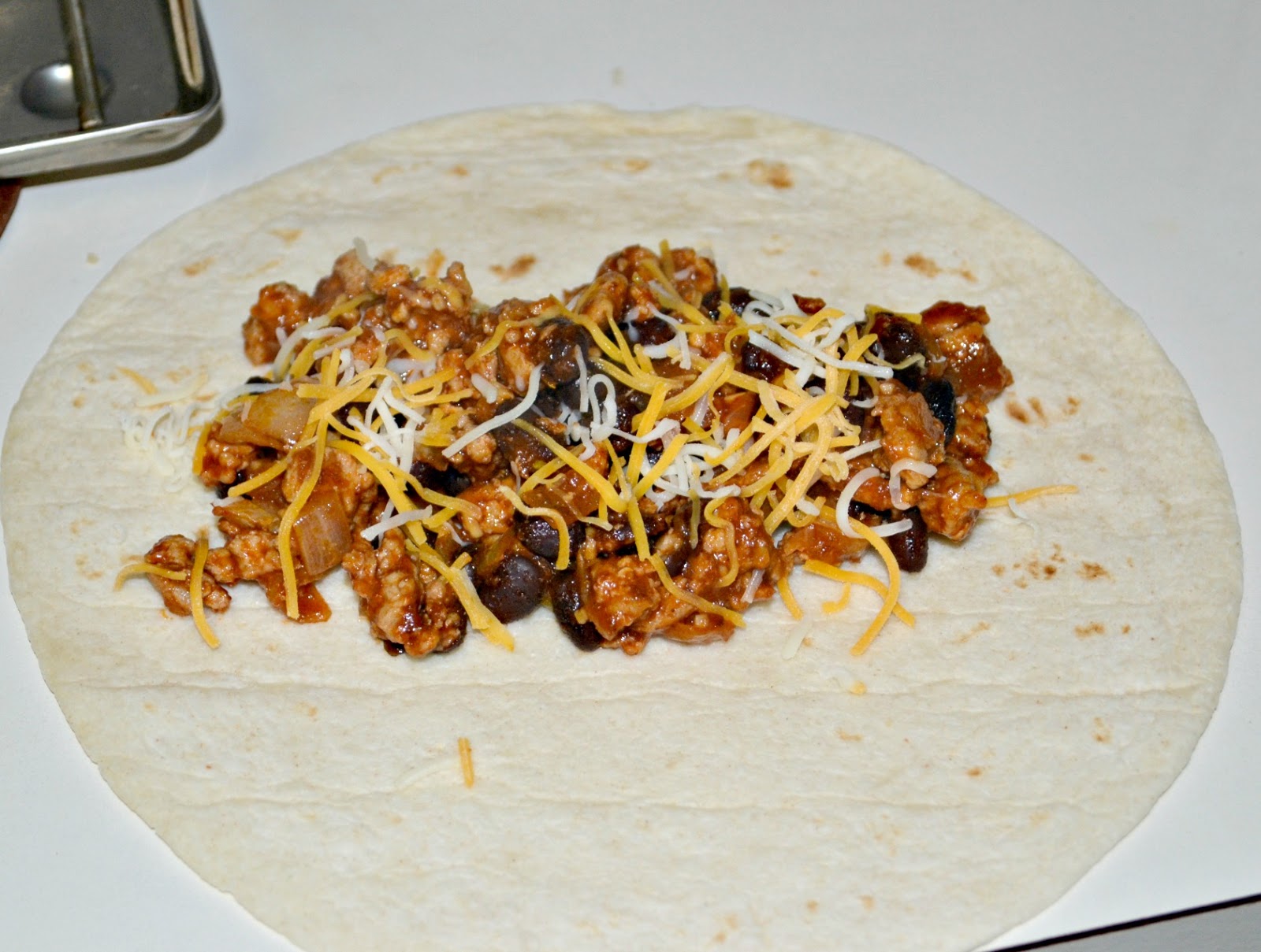 Baked Chicken Burritos with Sour Cream Poblano Sauce - Hezzi-D's Books