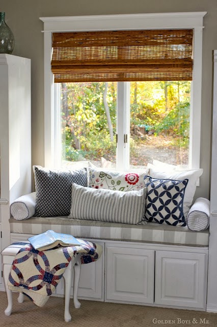window seat made from 2 upper cabinets in master bedroom via www.goldenboysandme.com