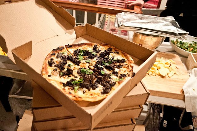 Open box showing midnight pizzas from Otto at Gary's Lofts