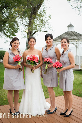 The Bride standing with the Bridesmaids holding bouquets
